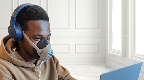 Person using SinuSauna mask for natural congestion relief without medication